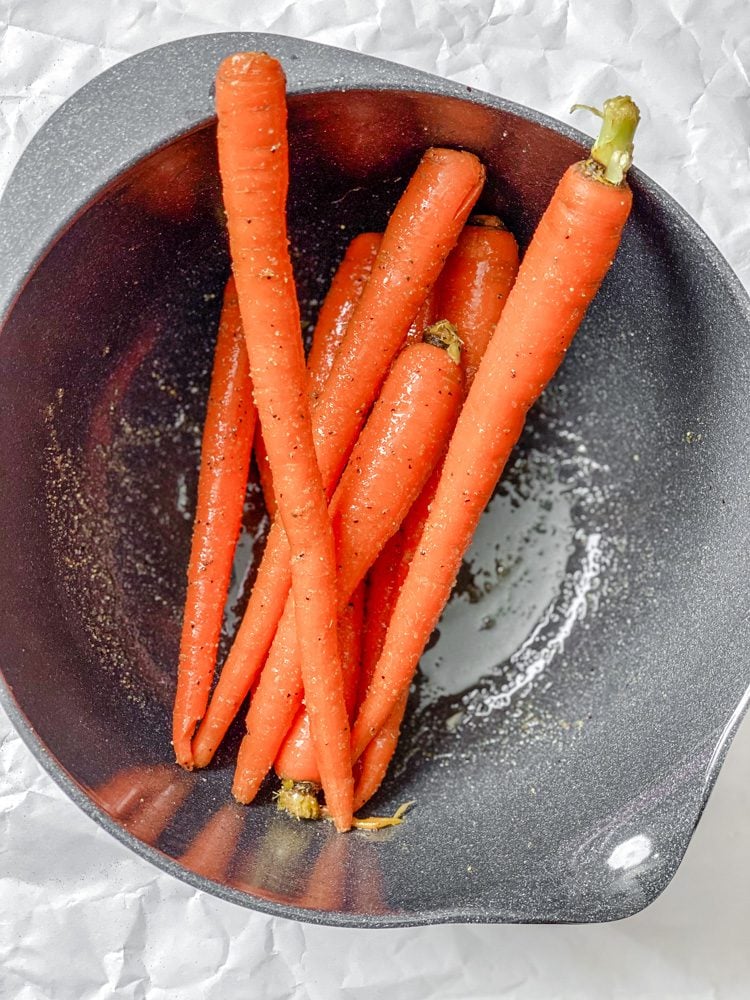 process shot showing carrots in a bowl