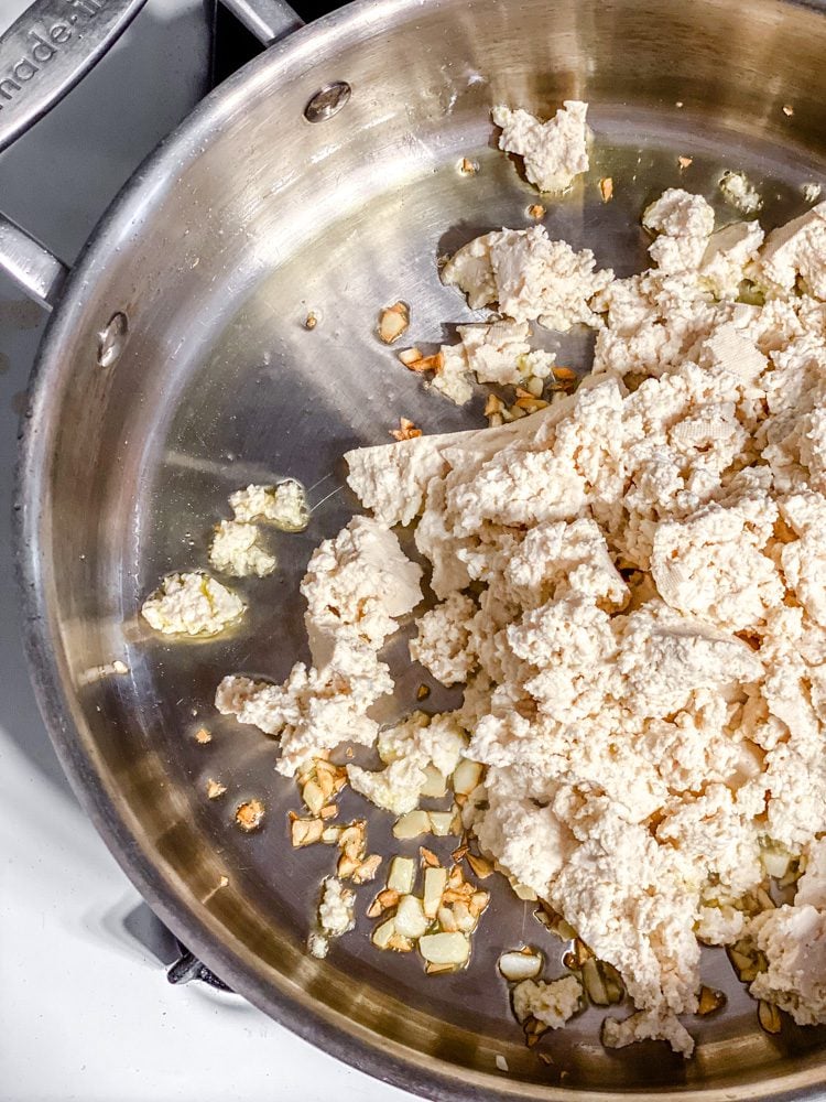 process shot of tofu cooking in pan