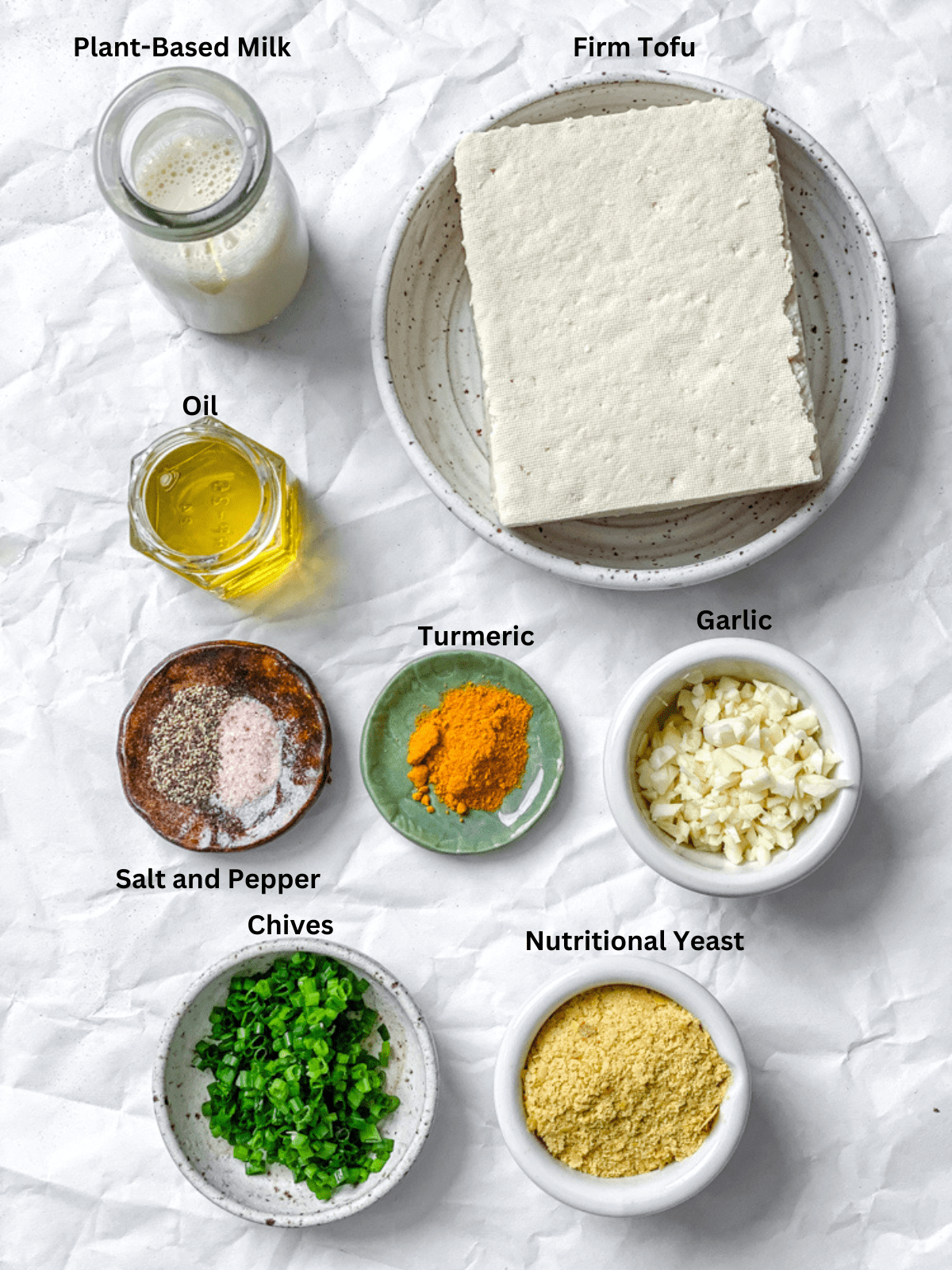 ingredients for The BEST Tofu Scramble measured outon a white surface