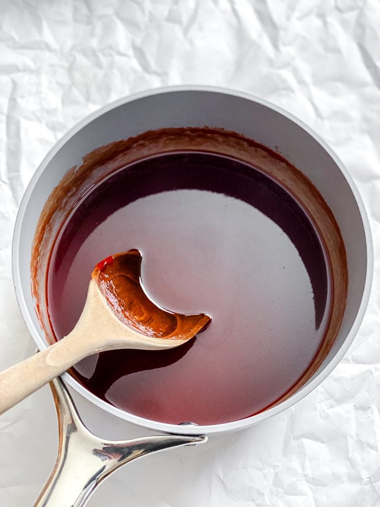 process shot showing stirring ingredients in pot
