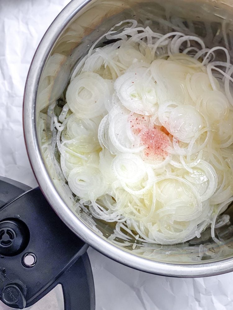 process shot showing onions in slow cooker