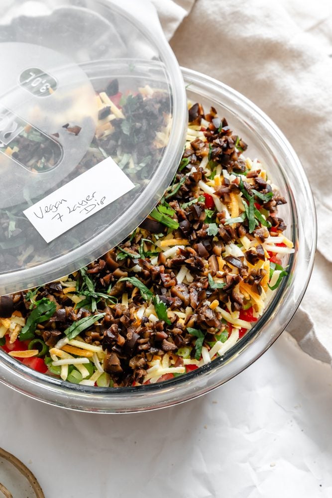 completed Vegan 7 Layer Dip (Quick and Easy) in a storage container