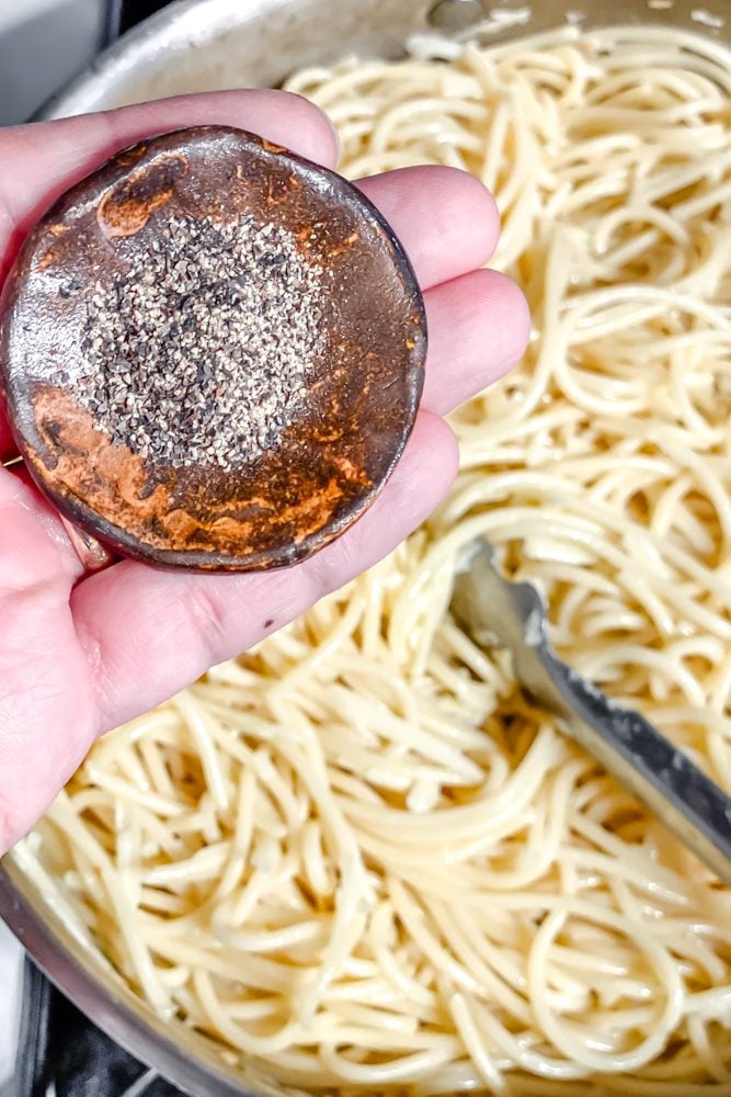 process shot showing adding pepper to pot