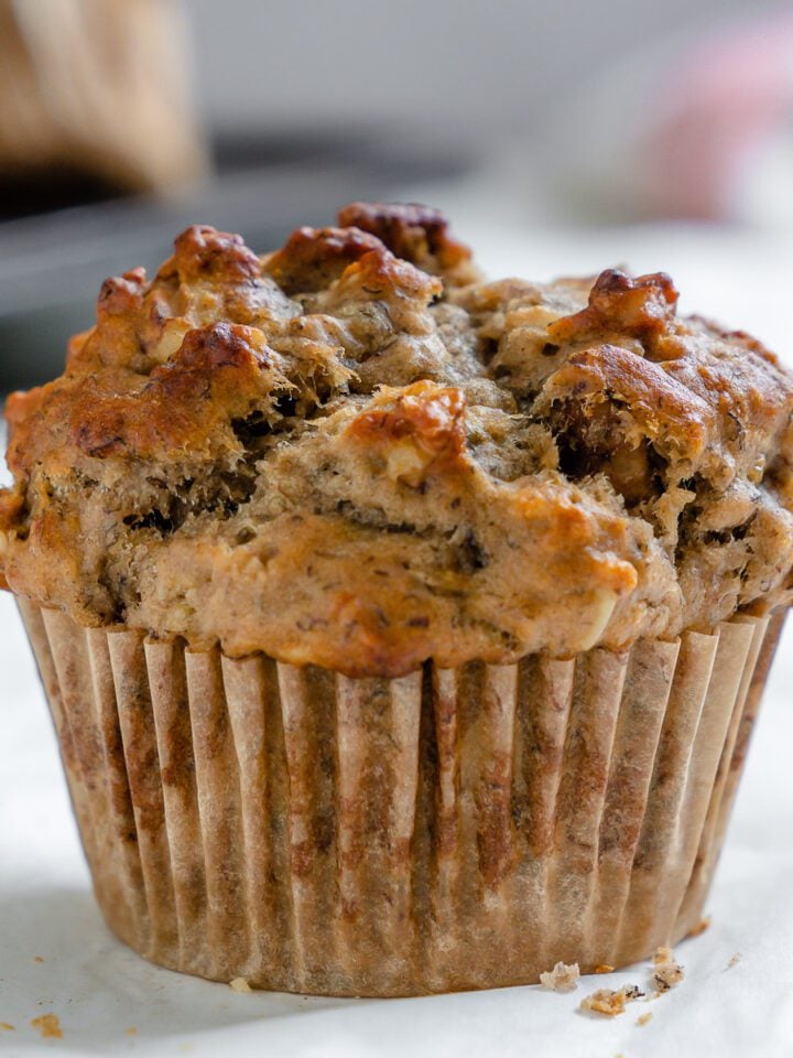 completed Vegan Banana Oatmeal Muffin on a white surface