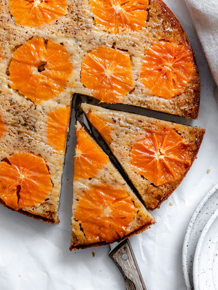 completed Orange Upside Down Cake on a white surface