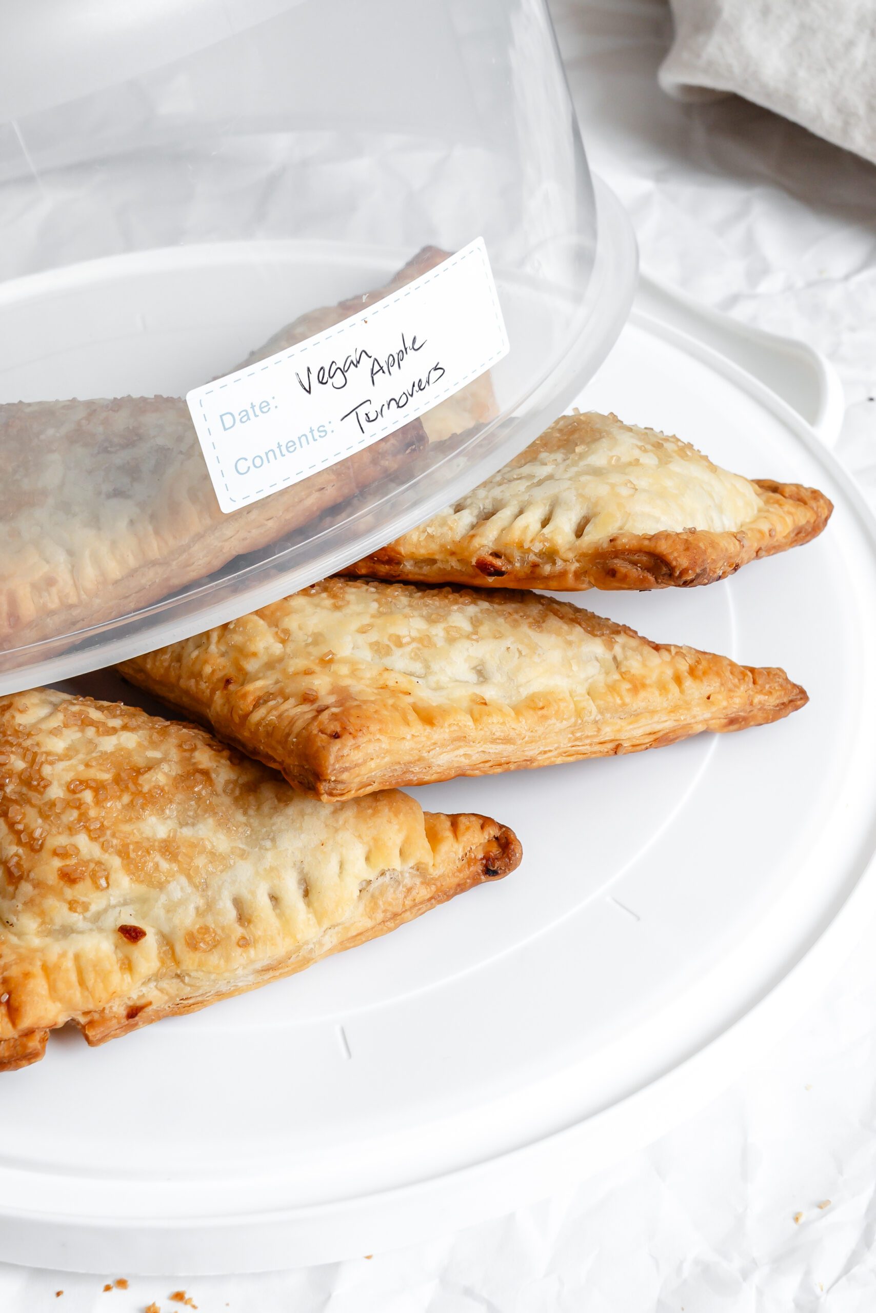 Completed Vegan Apple Turnovers in a storage container.
