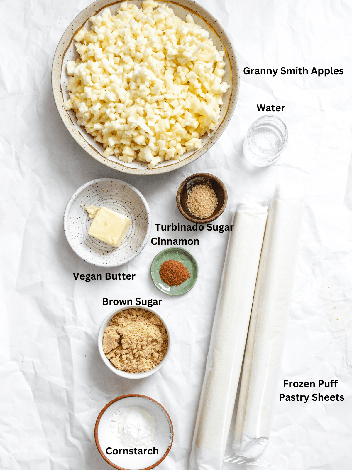 Ingredients for Vegan Apple Turnovers measured out on a white surface.