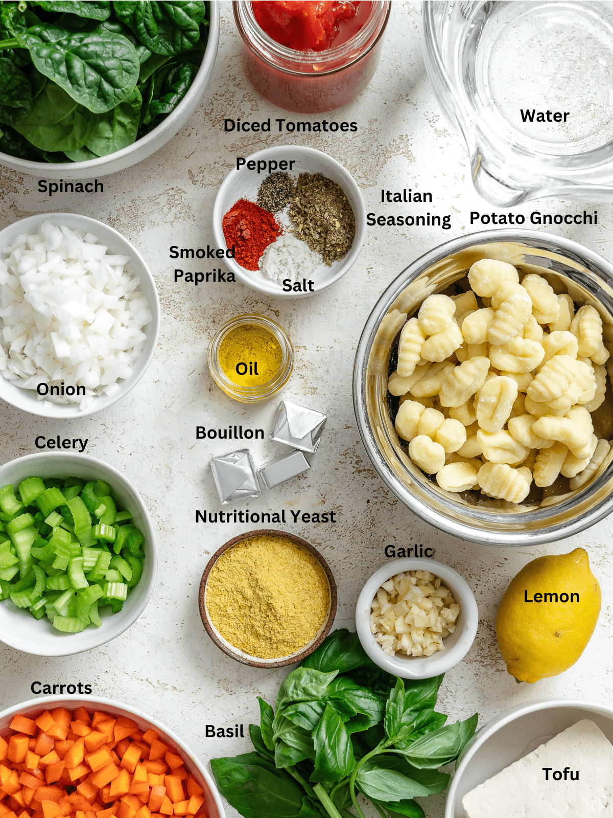 Ingredients for Vegan Gnocchi Soup measured out on a white surface.