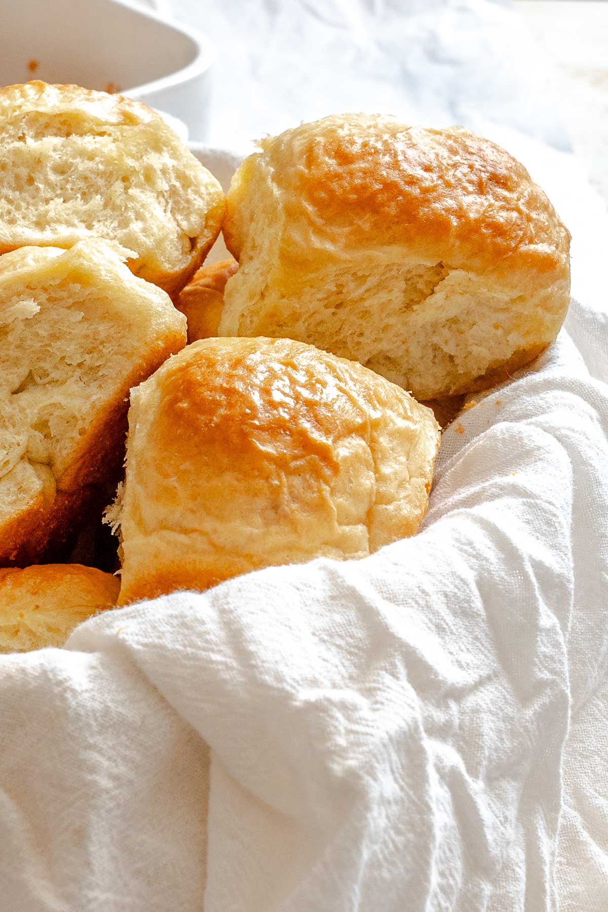 Completed Fluffy Vegan Dinner Rolls in basket.